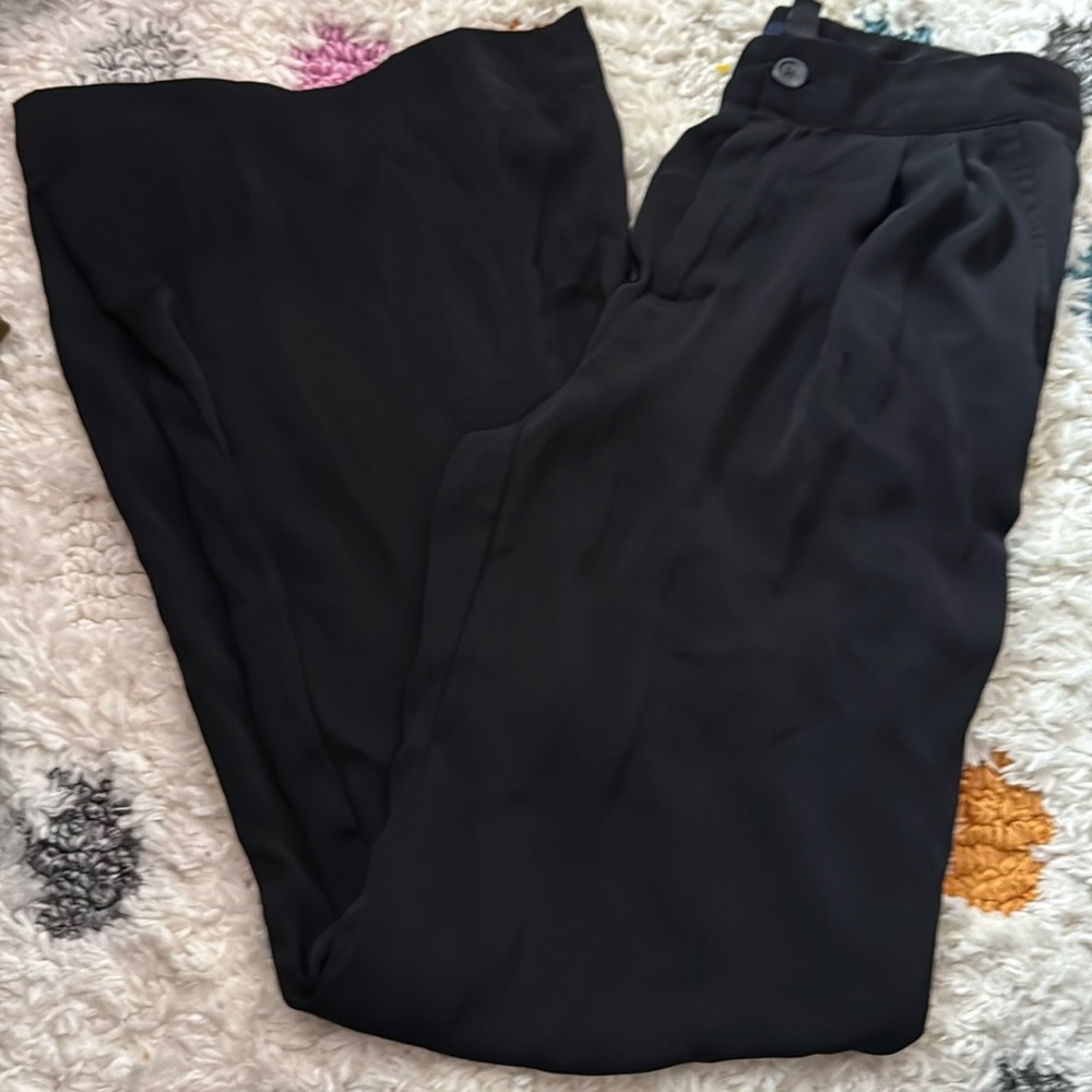 Dress pants. Flares at the bottom. Flow-y. Satin feel.